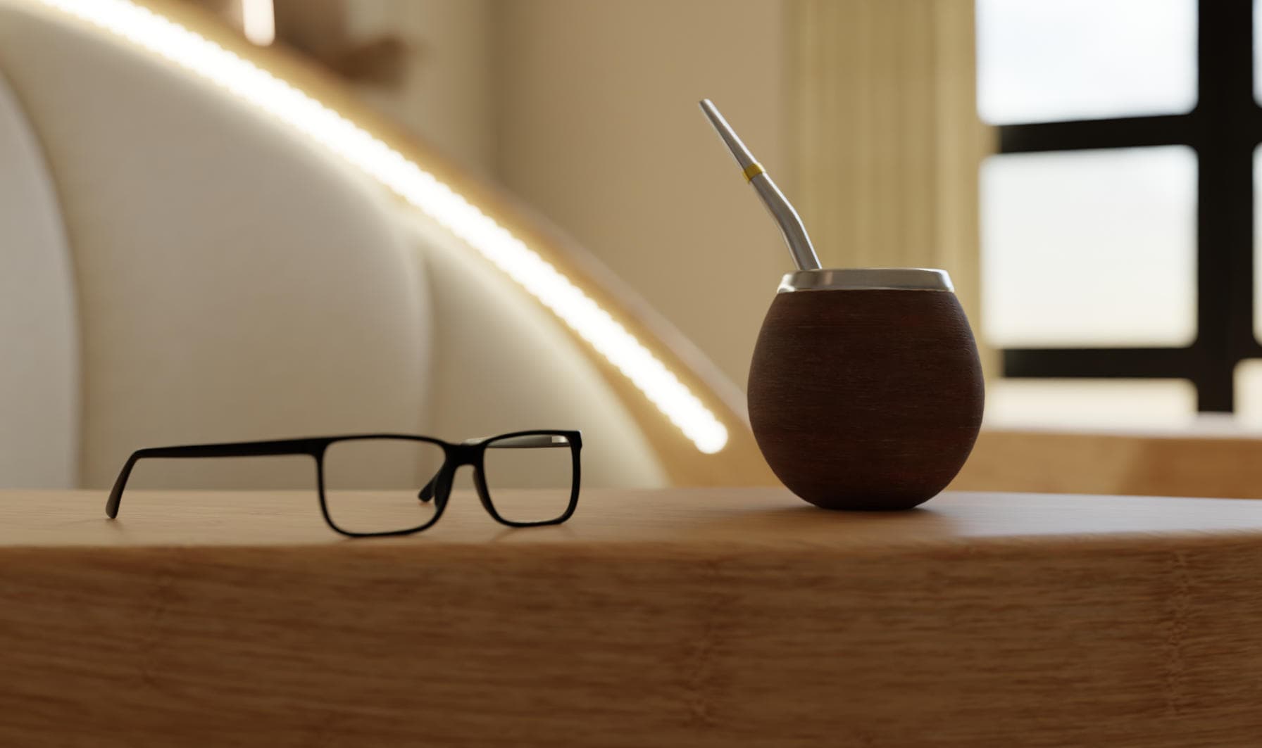Closeup of a mate gourd and glasses on a chair armrest